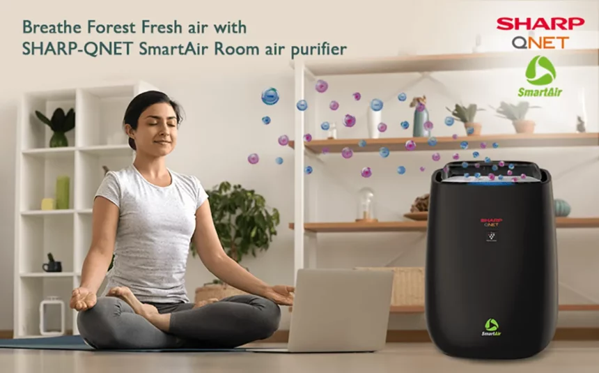 A young woman doing Yoga in front of SHARP Smart Air