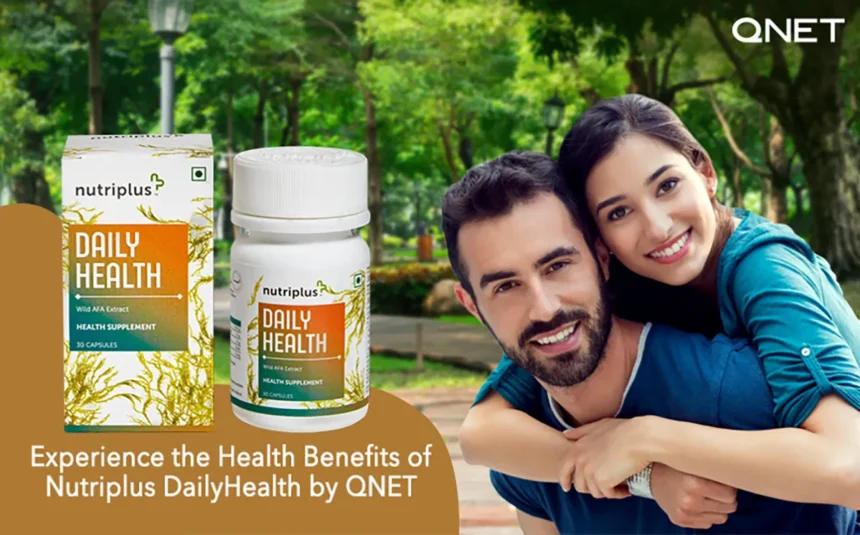 A young couple in a park with QNETs Nutriplus DailyHealth in the frame