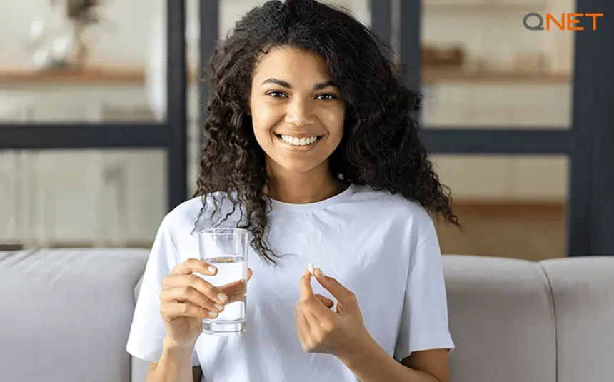 A young lady consuming Nutriplus-health supplements