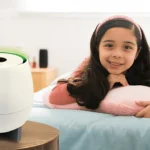 A small girl breathing pure air with HomePure Zayn by QNET