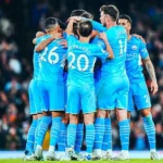 Manchester-City players celebrate after scoring a goal