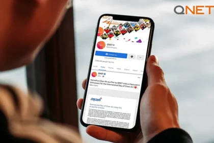 A young man going through QNET social media toolkit on his mobile