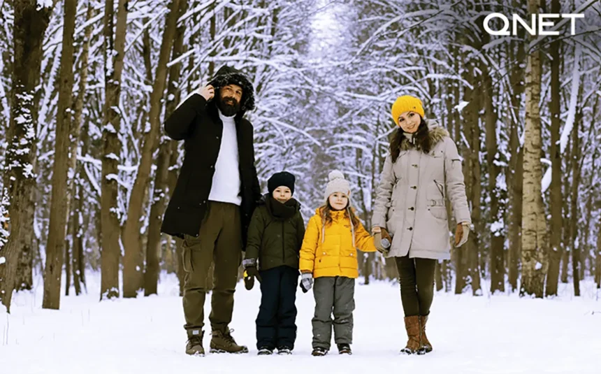 A family standing in snow