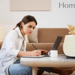 A young woman working next to Home pure Zayn Airpurifier