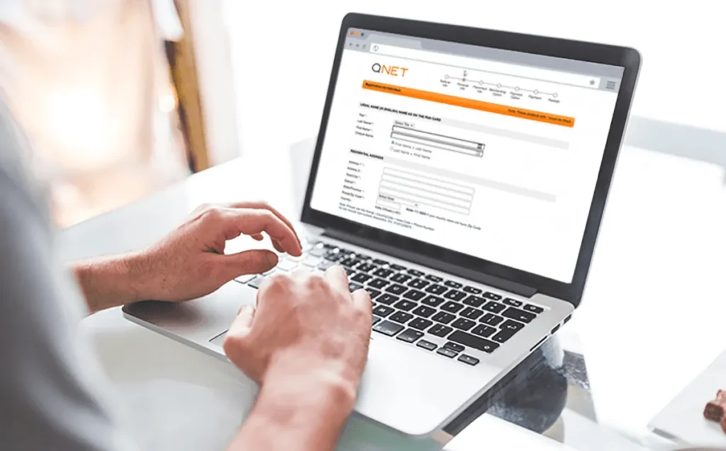 An individual signing up for the QNET business opportunity