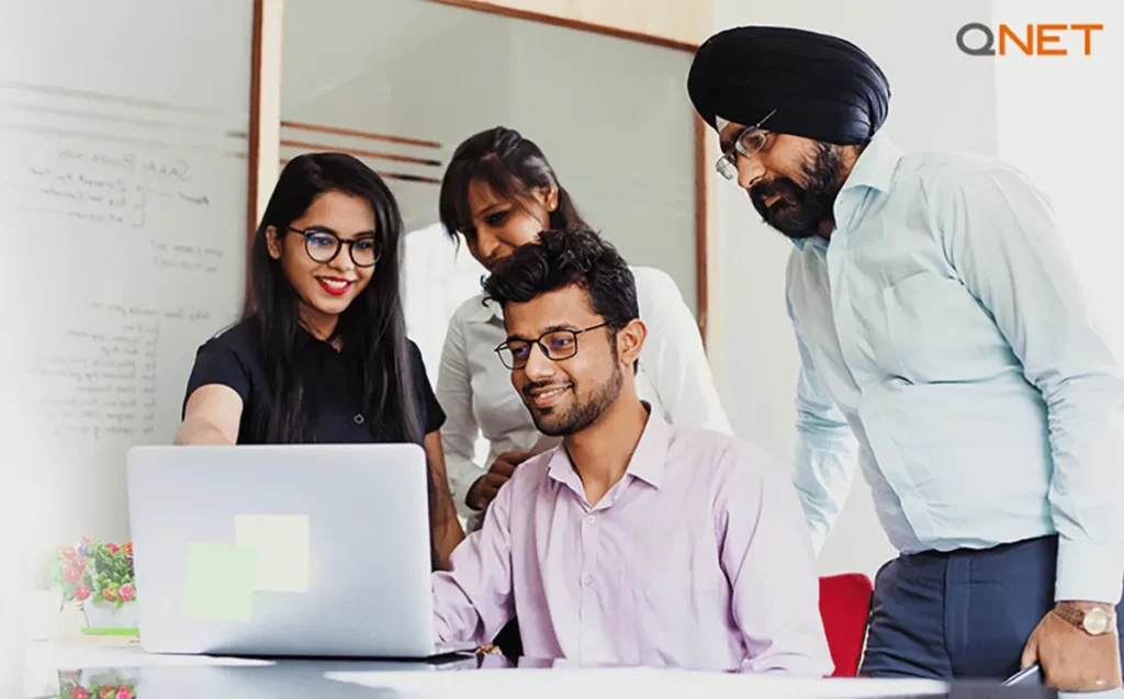 A group of Indian network marketers networking during a team meeting