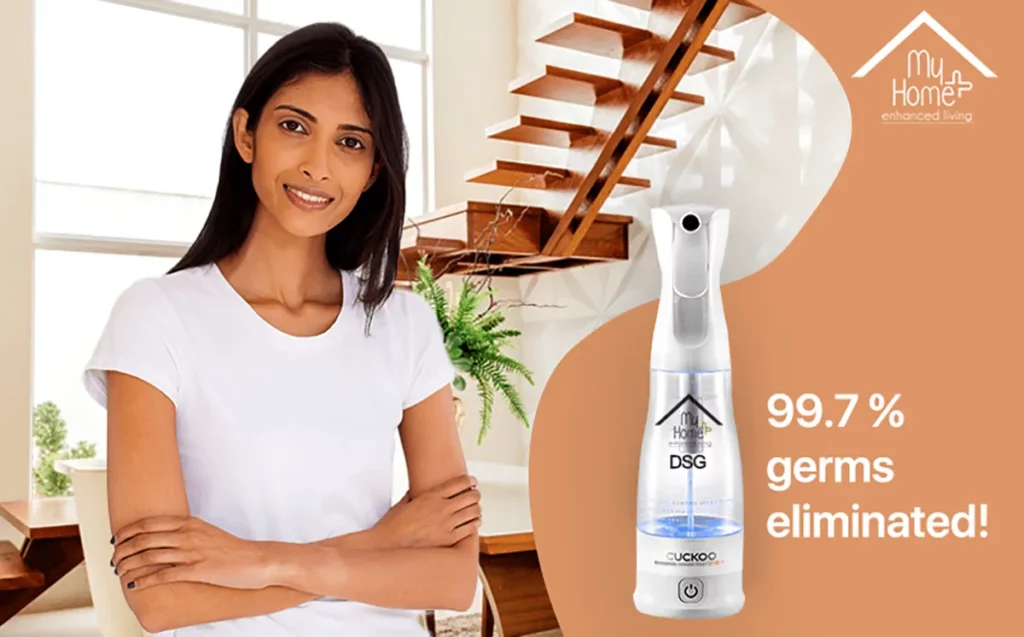 A young Indian woman standing in her home hands folded with MyHomePlus DSG in the frame