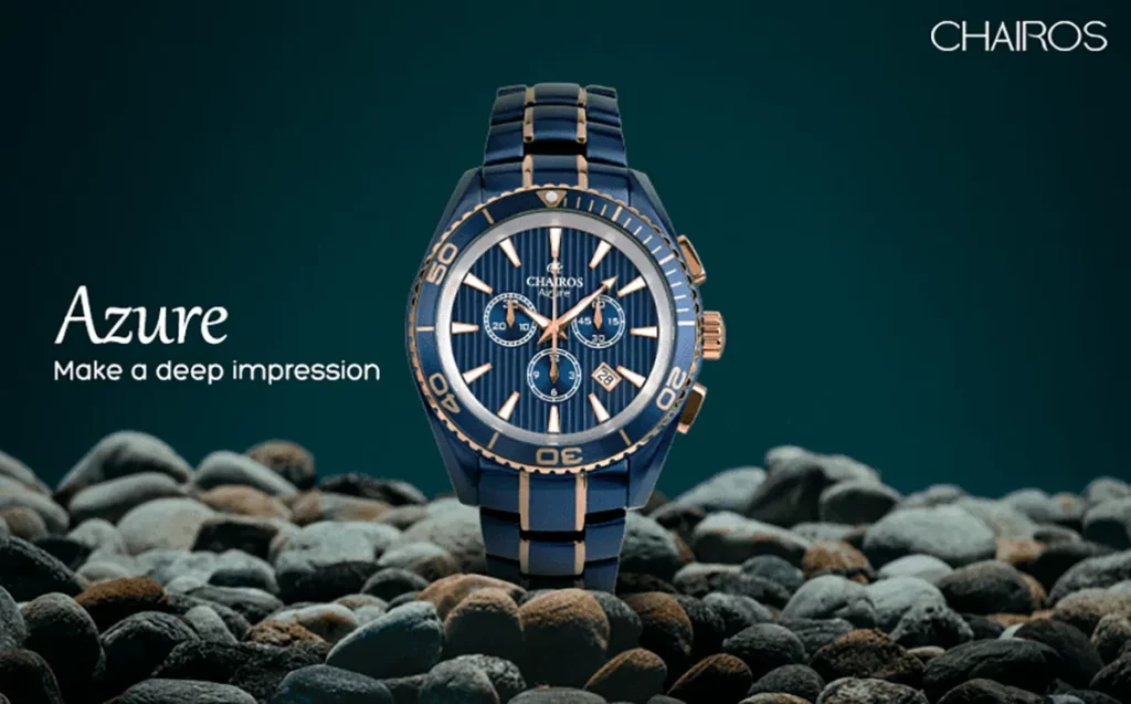 Chairos Azure watch on pebbles with a blue background