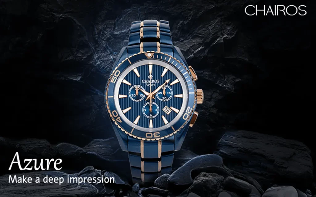 Close up of the Chairos Azure Watch with Black rocks in the background.