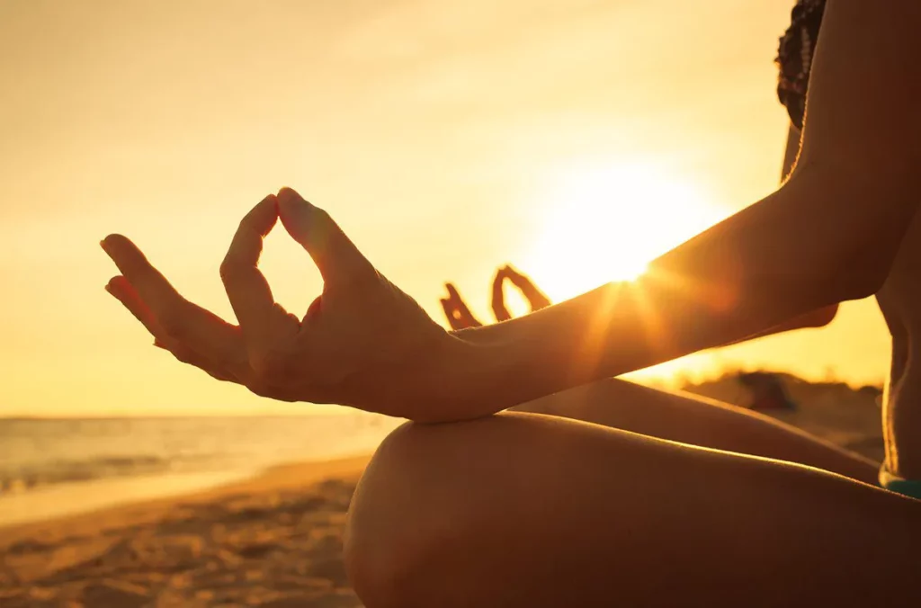 wellbeing: girl soaking sunshine at the beach