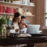 QNET India Mompreneur working along with her child