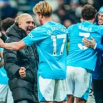 Pep Guardiola celebrates with Kevin De Bruyne after Manchester City wins